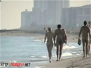 voyeurism at a warm naturist couple on the beach